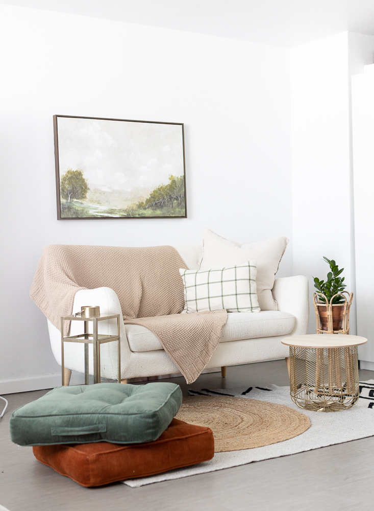 Sofa and decor of a a lifestyle photography studio in San Diego by The Portrait Mama