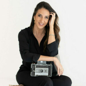 La Jolla Portrait Photographer The Portrait Mama posing with a vintage camera